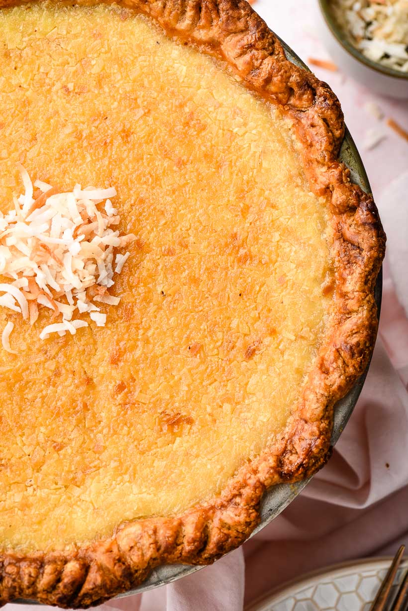 coconut custard pie topped with toasted coconut flakes