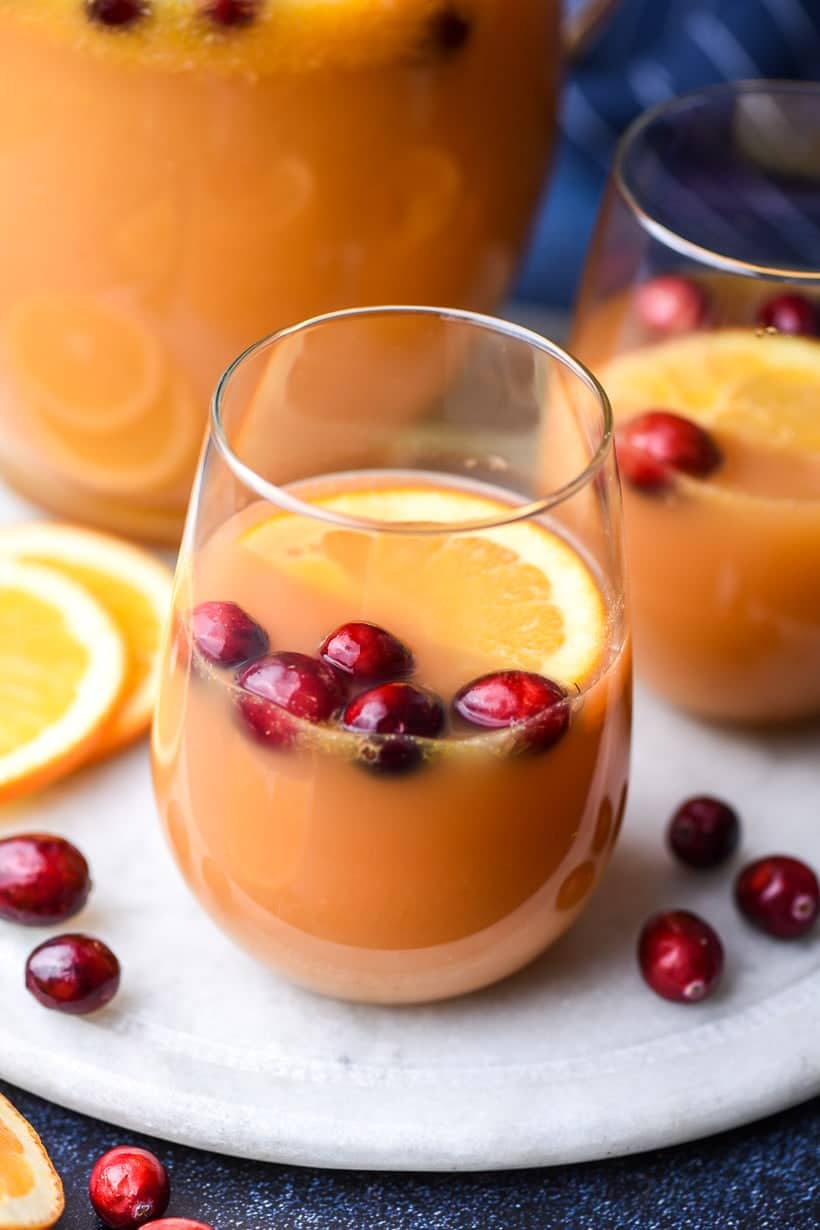 Glass of Brunch Punch with floating cranberries and orange slices