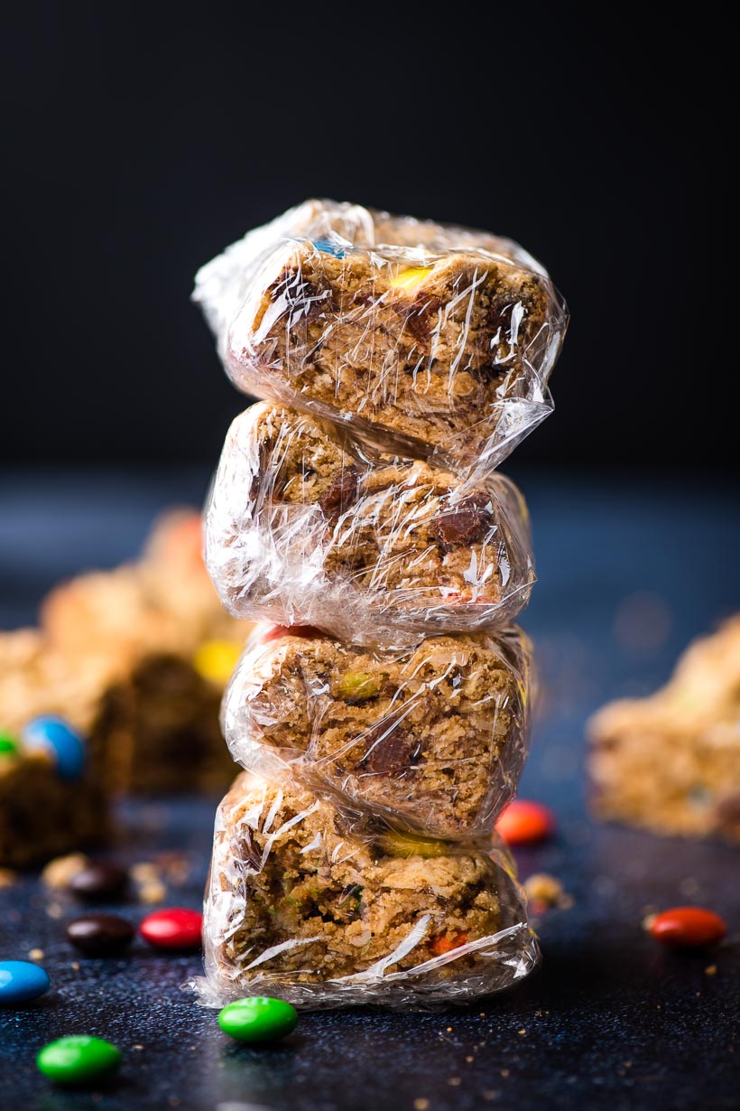 stack of cookie bars wrapped in saran wrap to be frozen