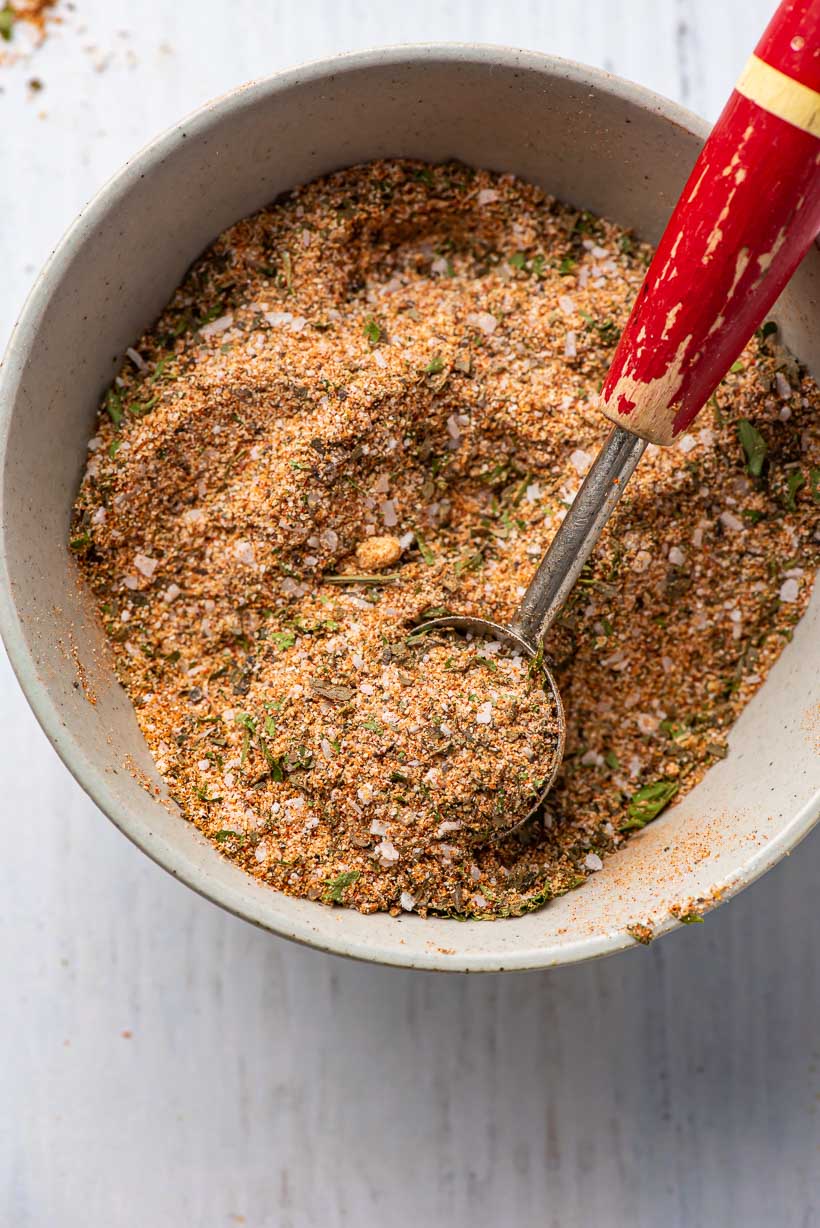 bowl of chicken seasoning with scoop