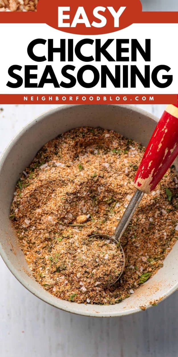 Bowl of chicken seasoning with a wooden measuring spoon dipping into it.