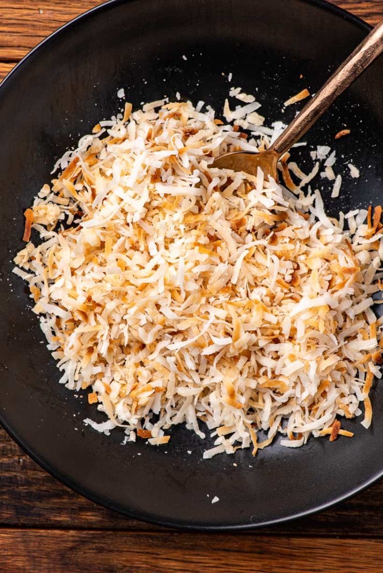 coconut toasted in the microwave in a black bowl