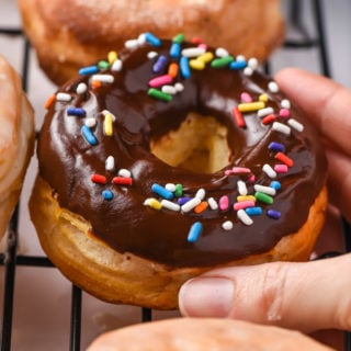 chocolate glazed air fryer donuts with sprinkles on top