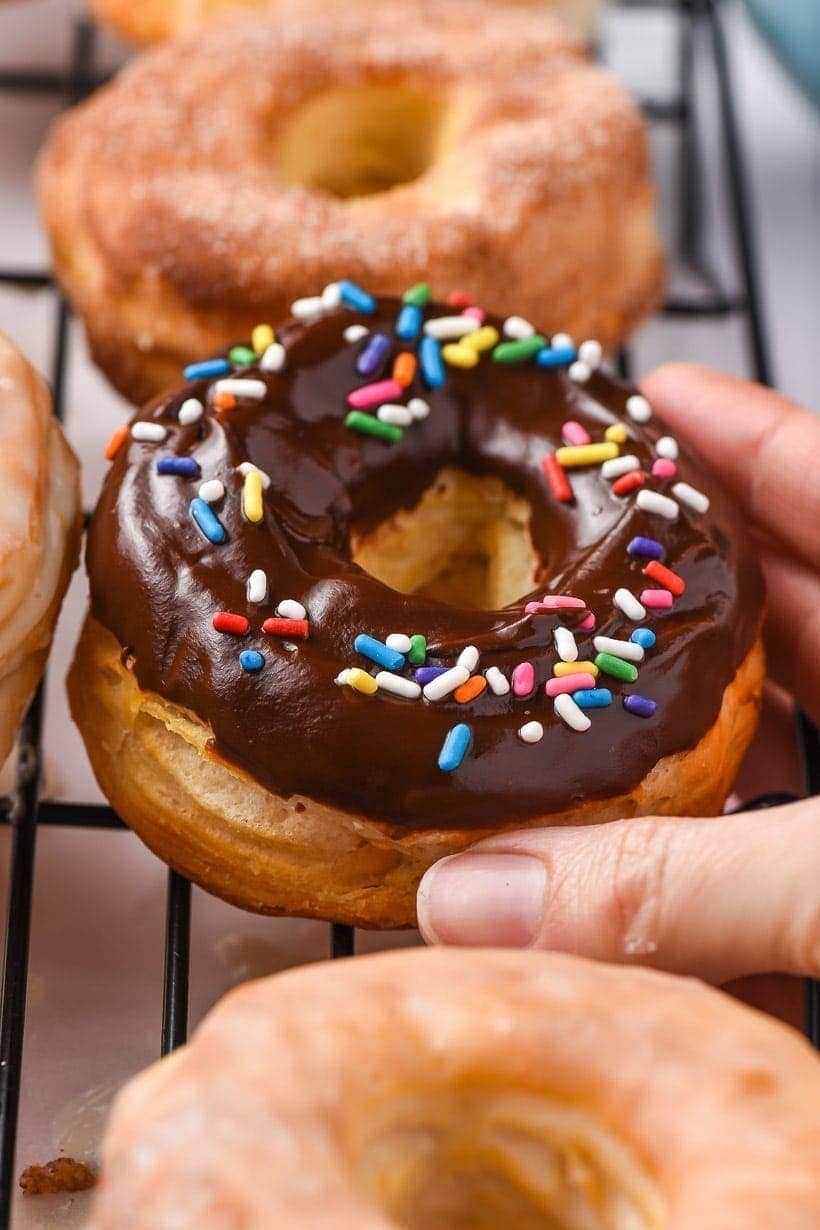 chocolate glazed air fryer donuts with sprinkles on top