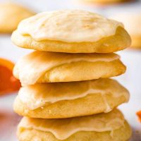 iced orange cookies in a stack of four