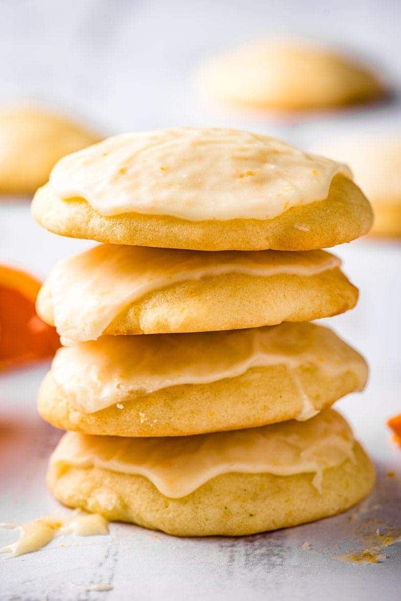 iced orange cookies in a stack of four