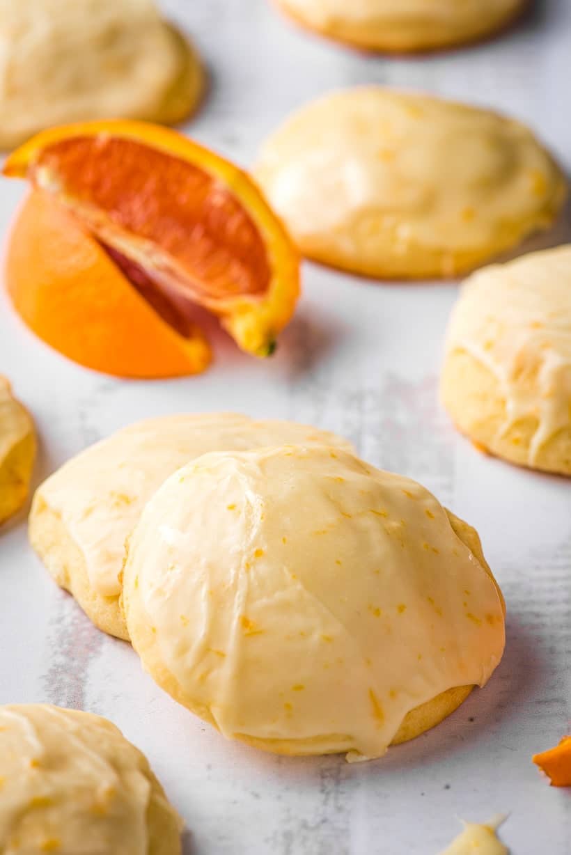 orange cookies and orange slices on a gray background