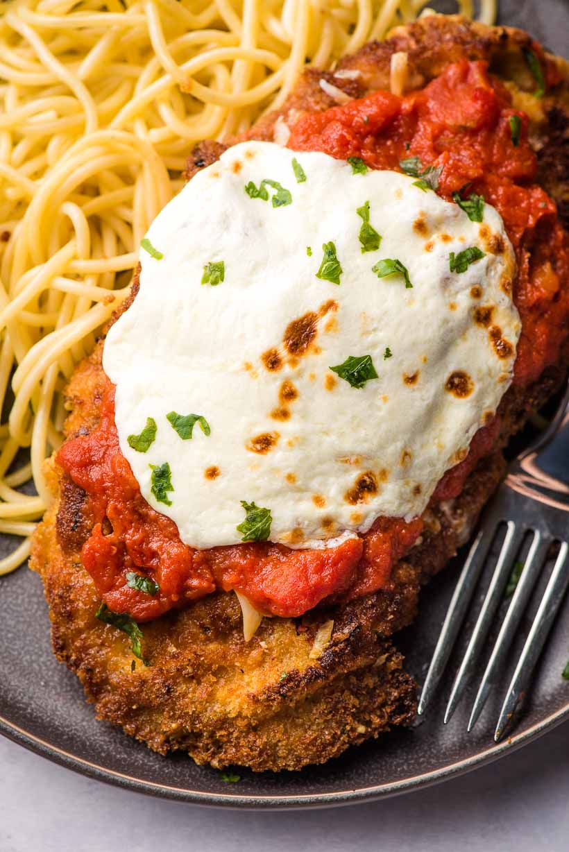veal parmesan with melted mozzarella cheese on top