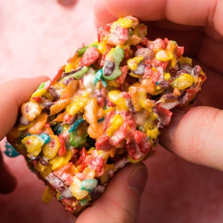 hands holding a Fruity Pebble Treat
