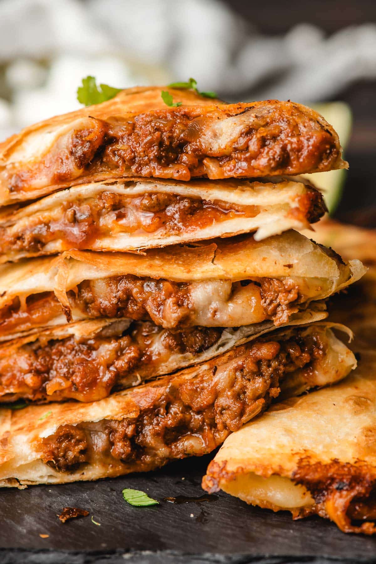 Stack of sliced ground beef quesadillas.