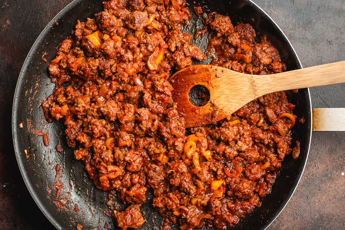 Sauteed ground beef, peppers, and onions with taco seasoning and tomato sauce.