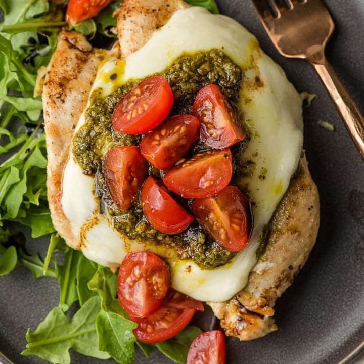 grilled chicken margherita with mozzarella, pesto, and tomatoes on top