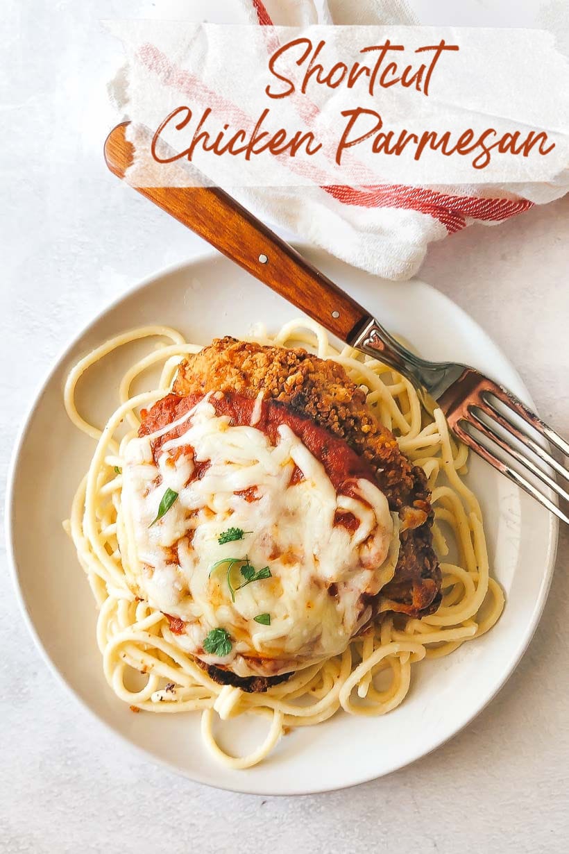 Easy Chicken Parmesan with Melted Mozzarella and marinara on top of spaghetti