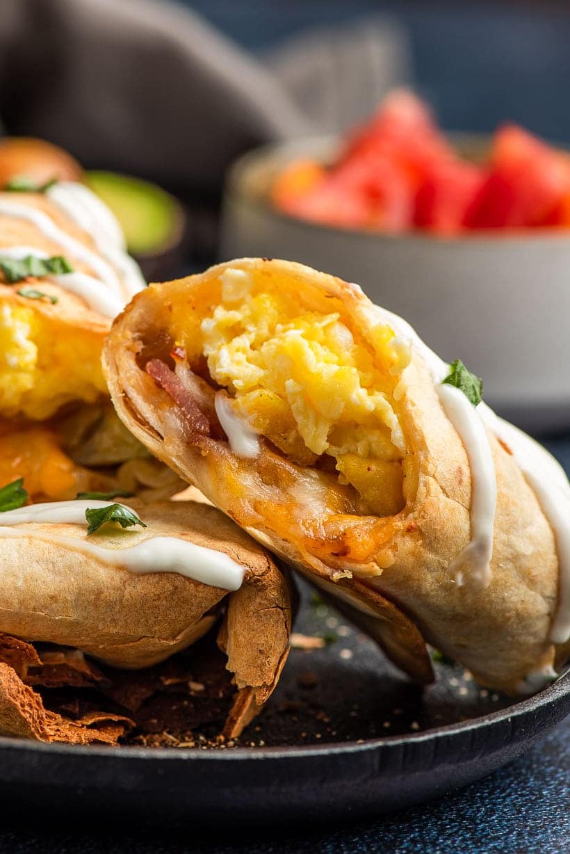 Scrambled eggs and bacon inside an air fryer breakfast burrito