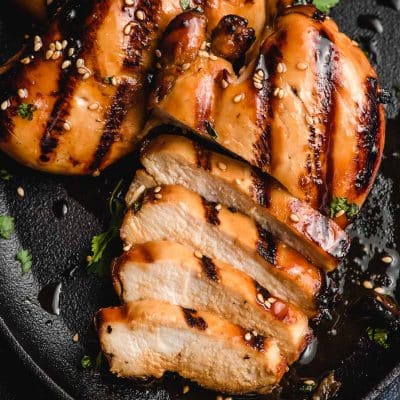 Grilled Asian marinated chicken breast, half sliced.