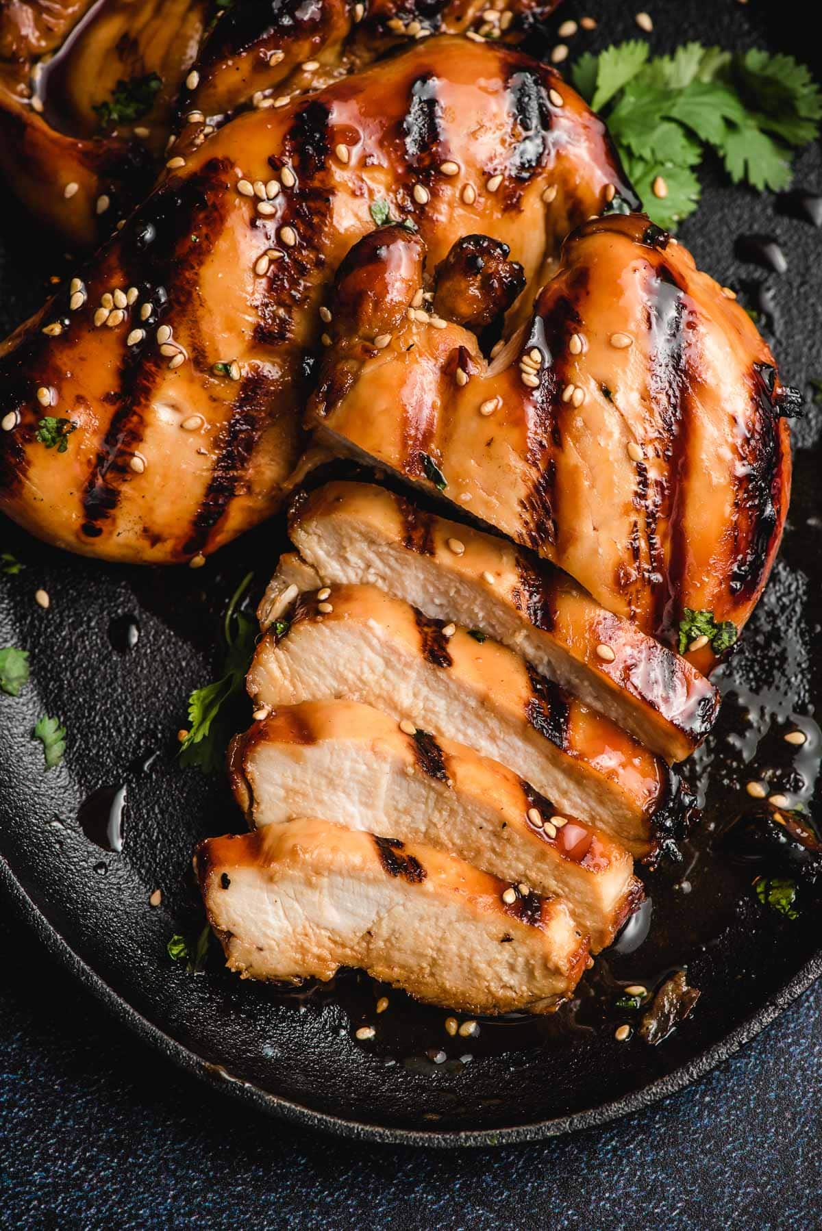 Grilled Asian chicken breast, half sliced.