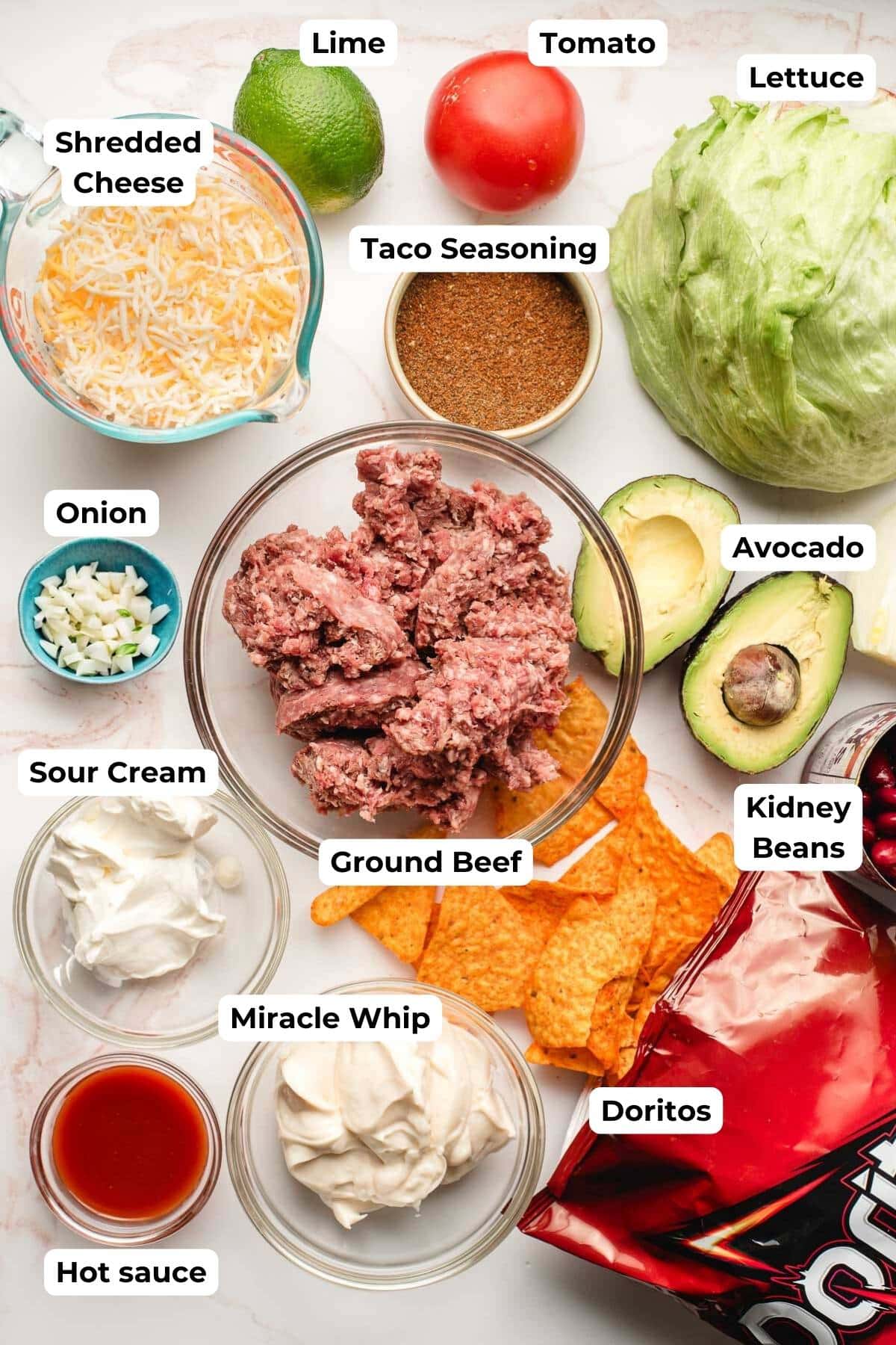 Ingredients for Doritos Taco Salad in prep bowls.