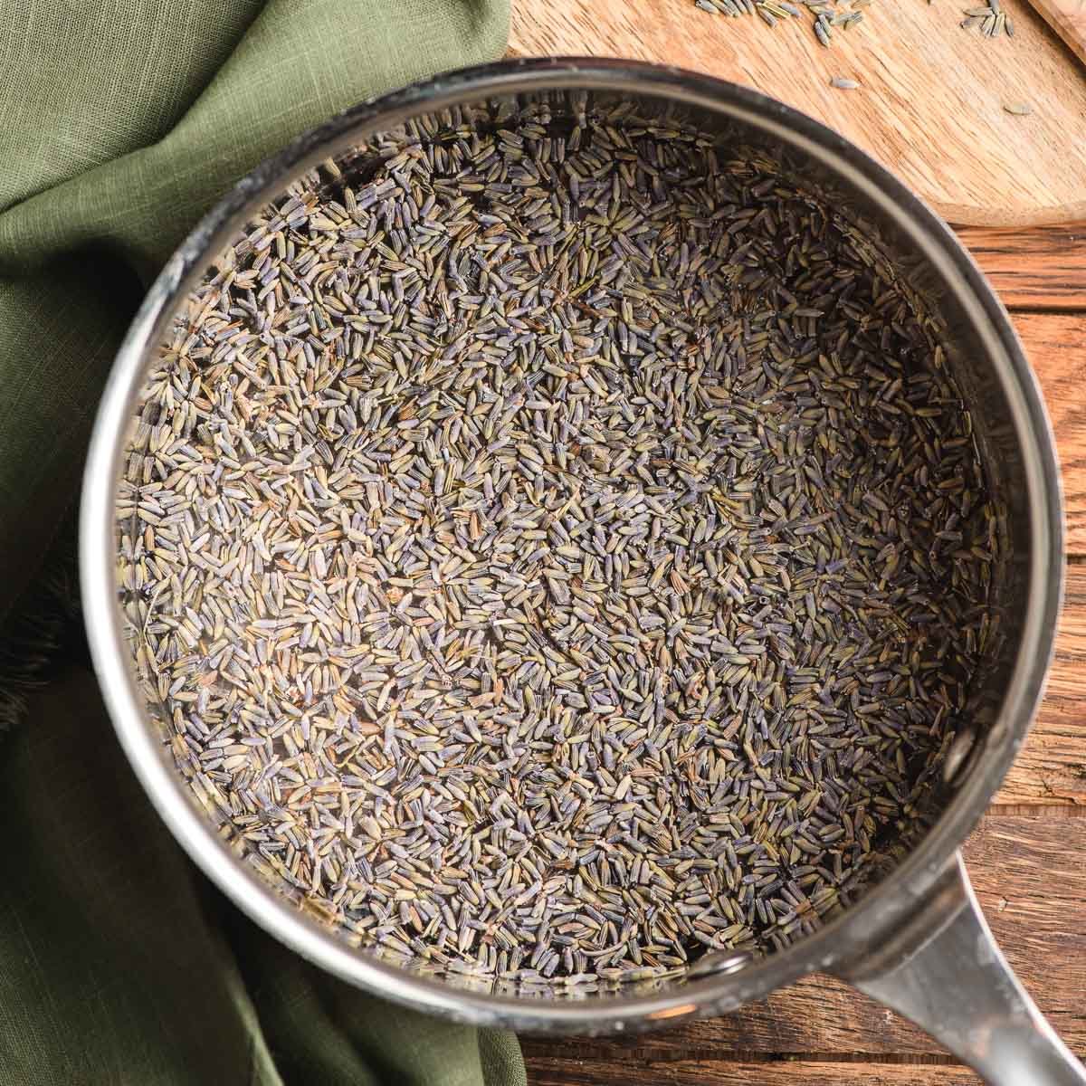 Dried lavender buds and water in a sauce pan.