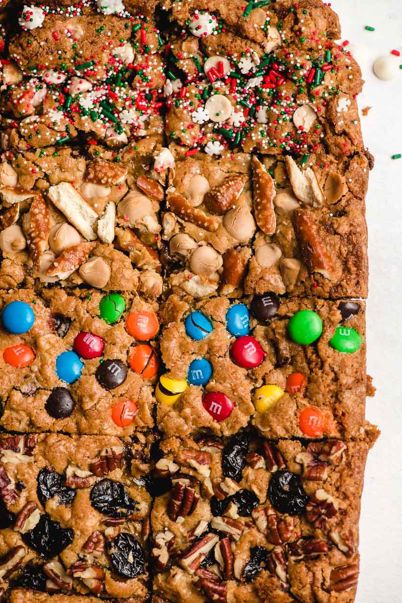 oatmeal chocolate chip bars with M&Ms, sprinkles, nuts, and pretzels on top