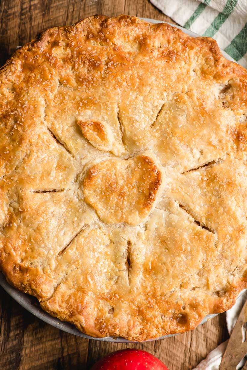 old fashioned apple pie with an apple design on top