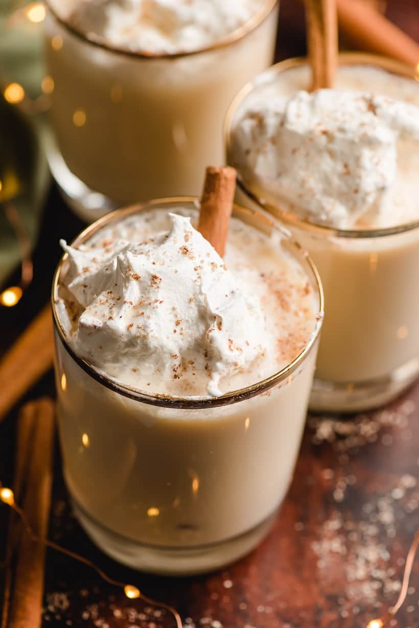 bourbon eggnog in a gold rimmed glass