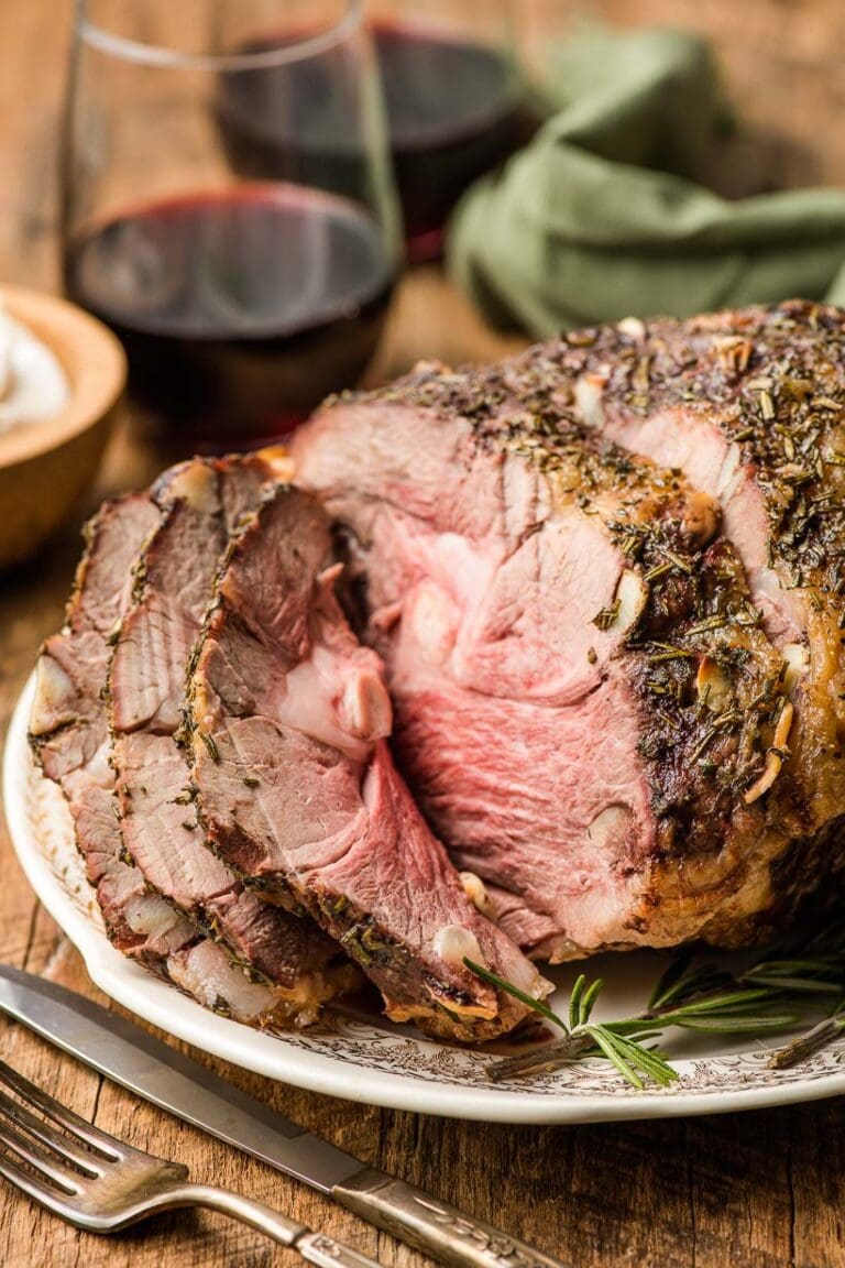 a carved lamb roast on a dinner table