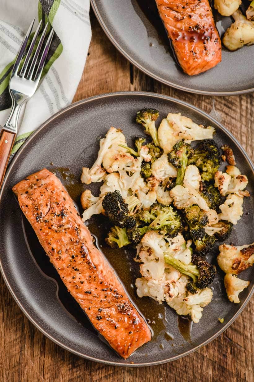 honey soy salmon on a gray plate with roasted vegetables