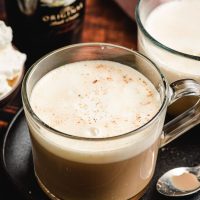 Irish Cream Coffee in a glass mug with whipped cream and nutmeg on top.