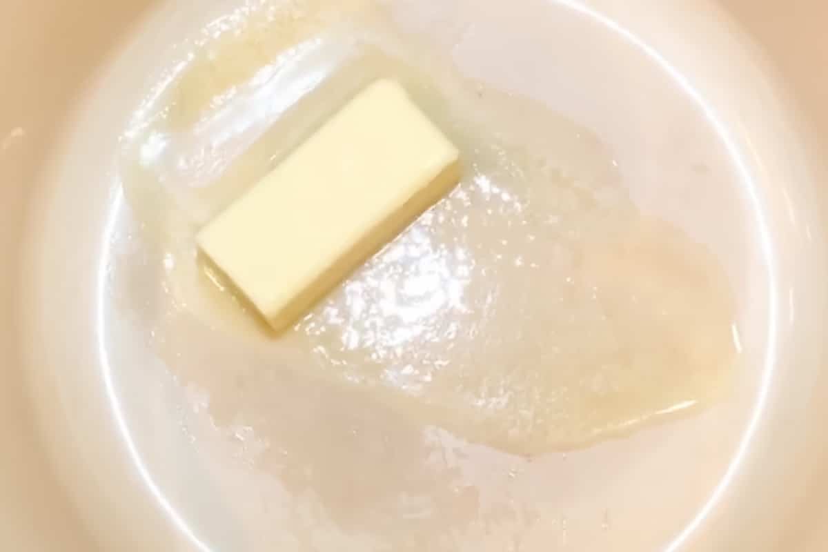 Butter melting in a pot over medium heat.