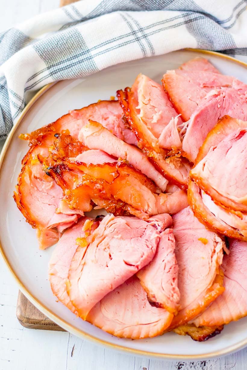 closeup of spiral sliced glazed ham on a serving platter