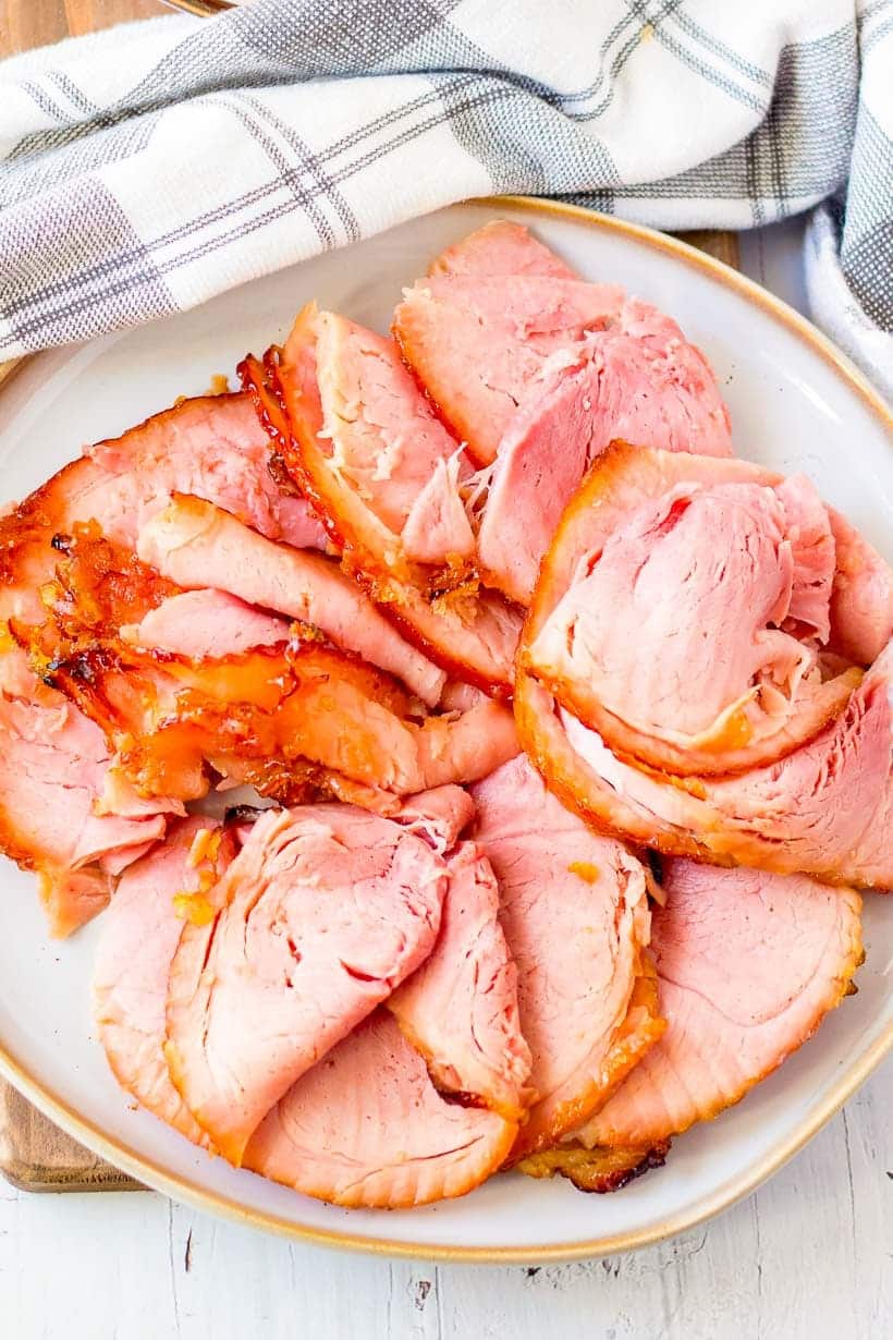 overhead shot of a serving plate full of sliced Easter ham