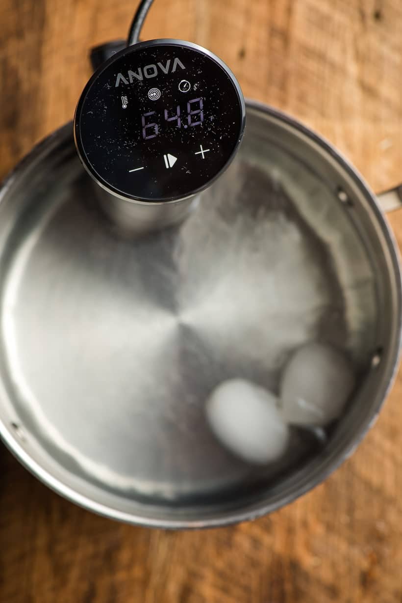 sous vide poached eggs cooking in a stock pot