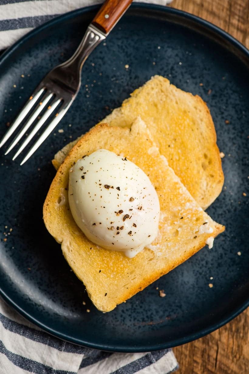 a sous vide poached egg served on buttered toast