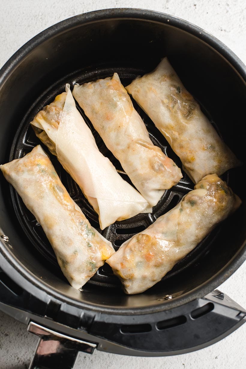 Rolled up Southwest Egg Rolls in Air Fryer before cooked.