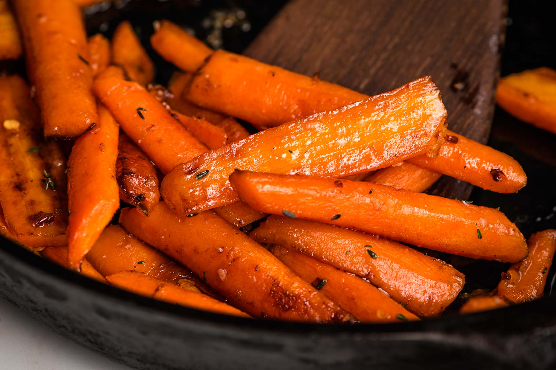 Carrots being sauteed in a skillet