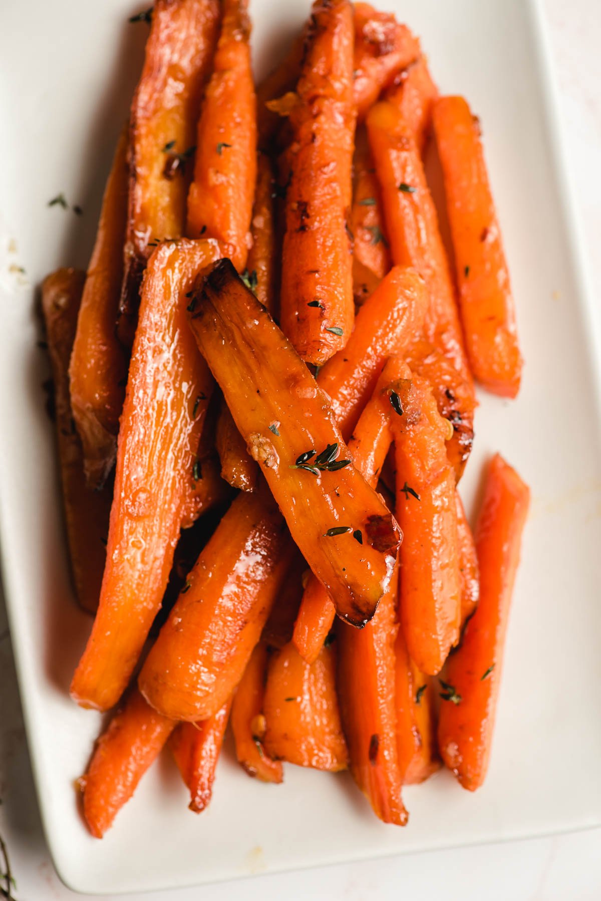 A serving plate of sauteed carrots.
