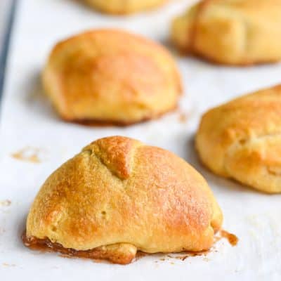 Baked resurrection roll made with crescent dough on a sheet pan.