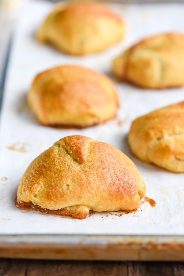 Baked resurrection roll made with crescent dough on a sheet pan.