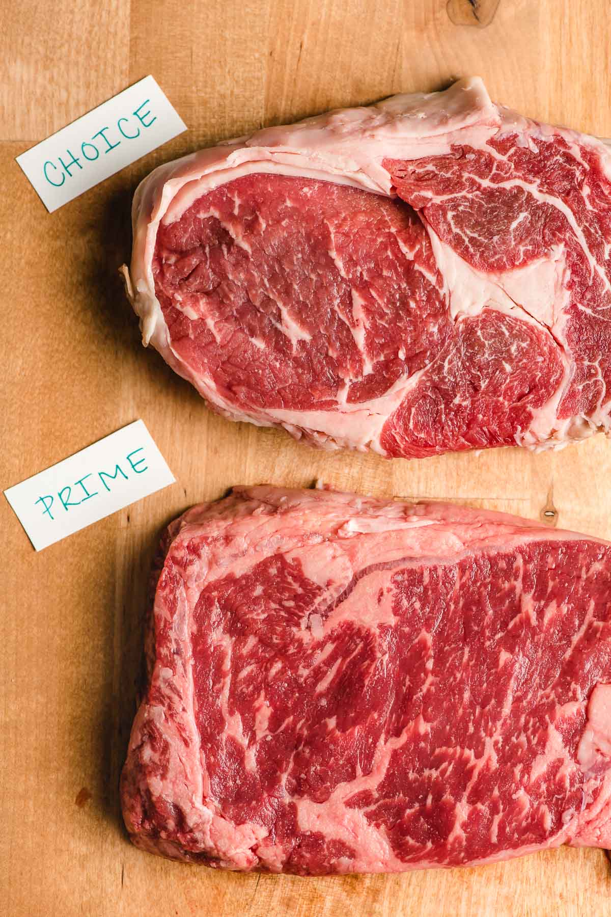 Choice vs prime beef ribeye steaks.