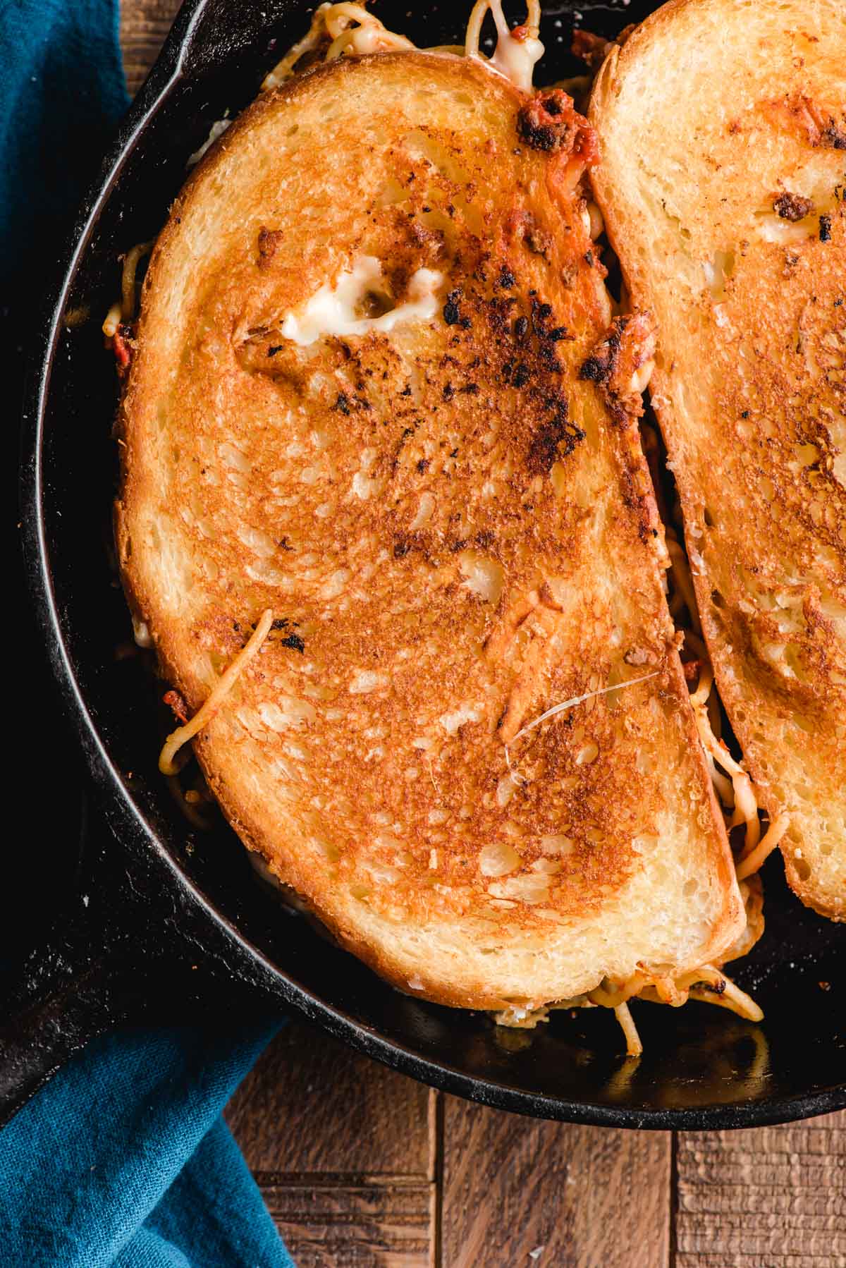 Parmesan crusted grilled cheese in a cast iron skillet.