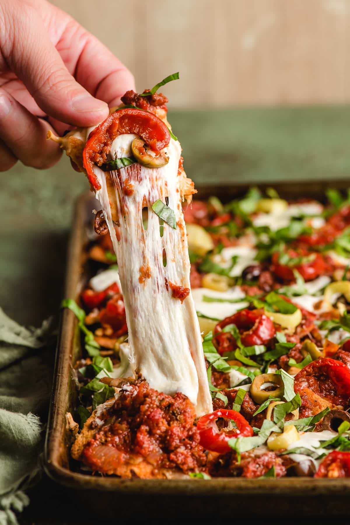 Mozzarella cheese pull on Italian Nachos.