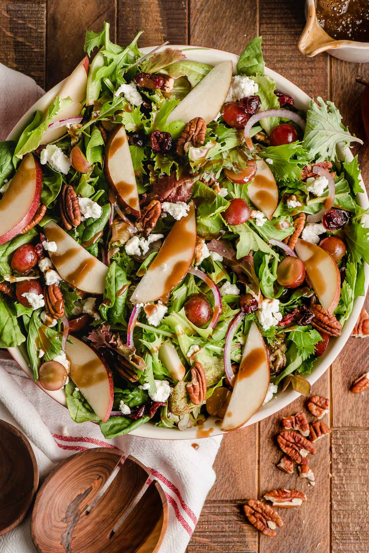 Autumn salad with pears, goat cheese, cranberries, and pecans.