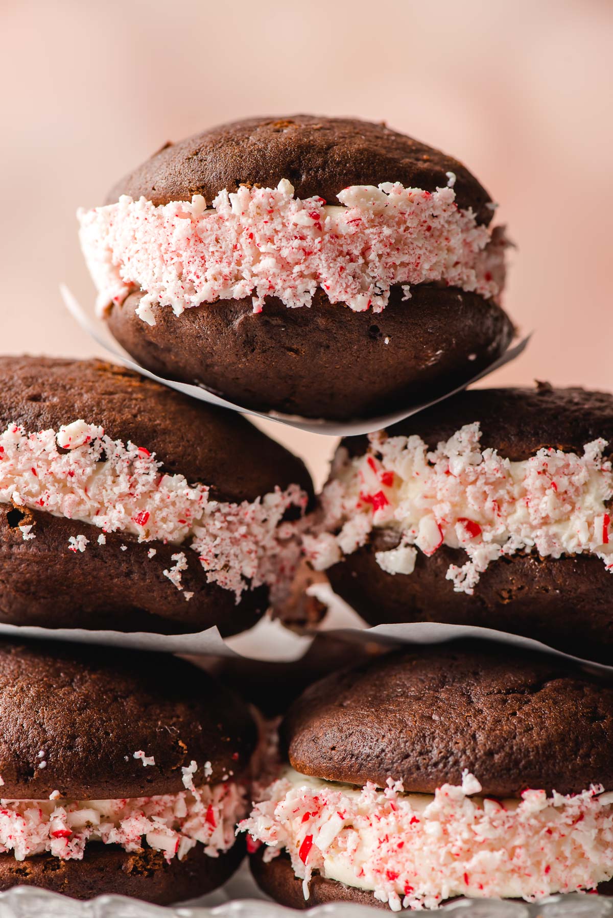 Whoopie pies with crushed peppermints, stacked on a plate.