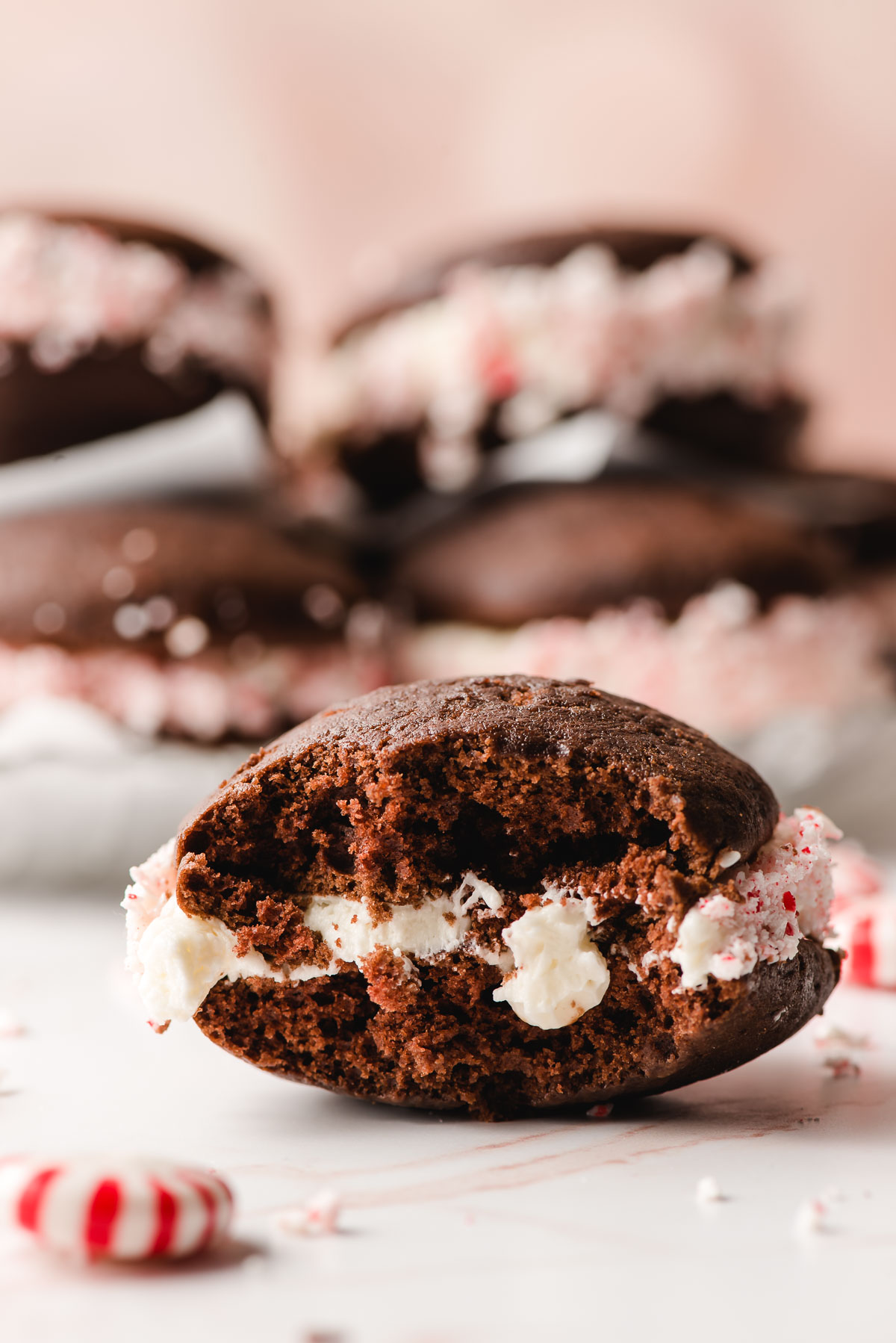 Peppermint whoopie pie with a bite taken out of it.