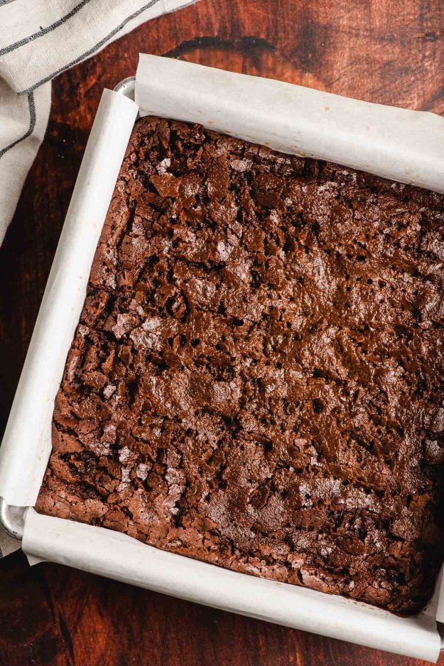 Coffee and rum soaked brownies in a pan.