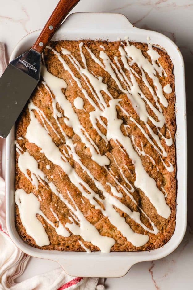 Freshly baked banana crumb cake drizzled with cream cheese frosting.