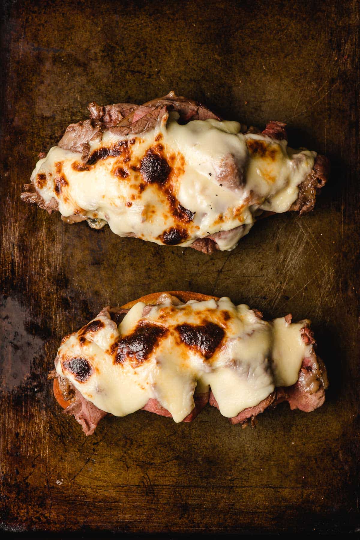 American cheese warmed on top of prime rib and garlic bread.
