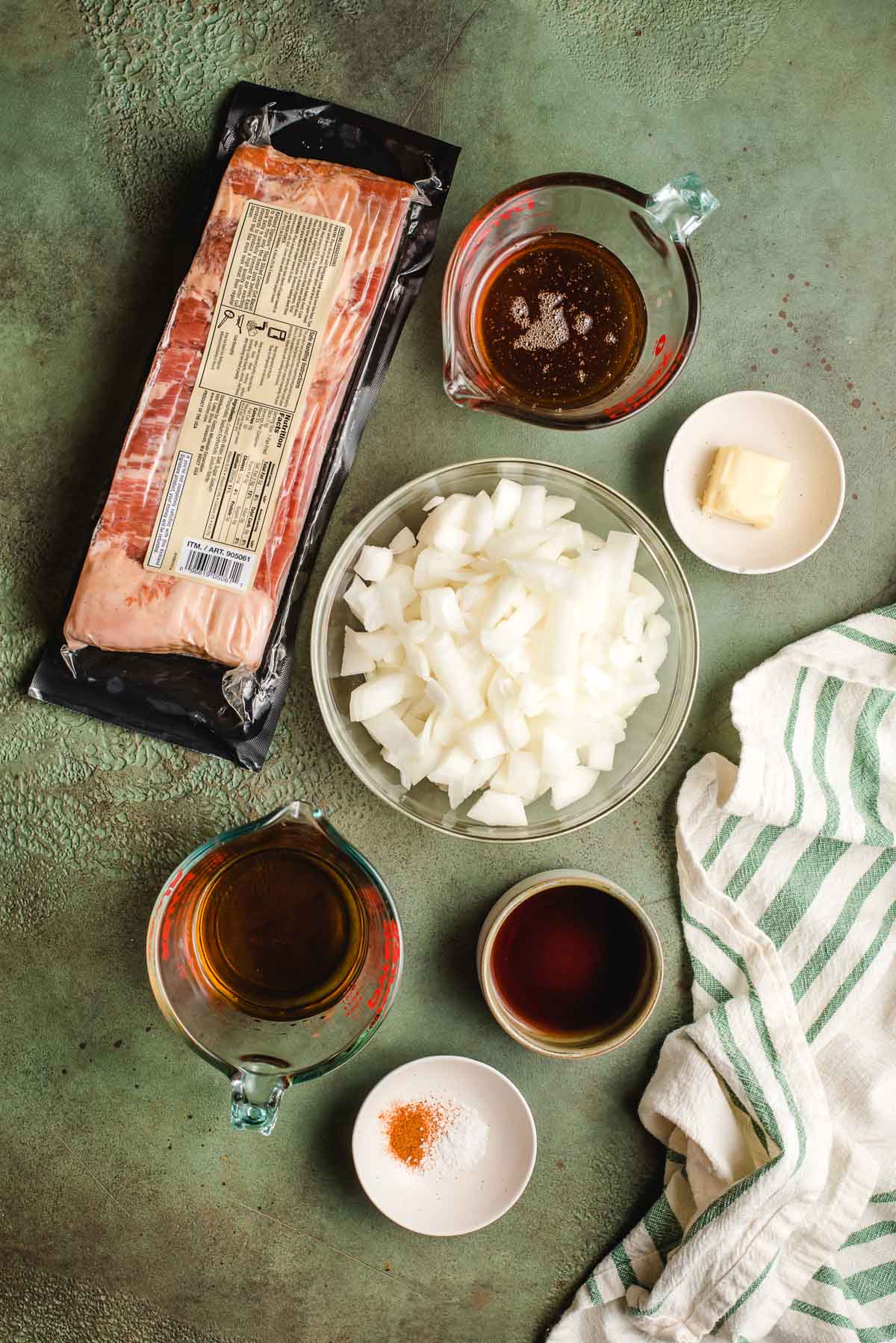 Bacon, honey, chopped onions, seasonings, bourbon, and balsamic vinegar in small bowls.