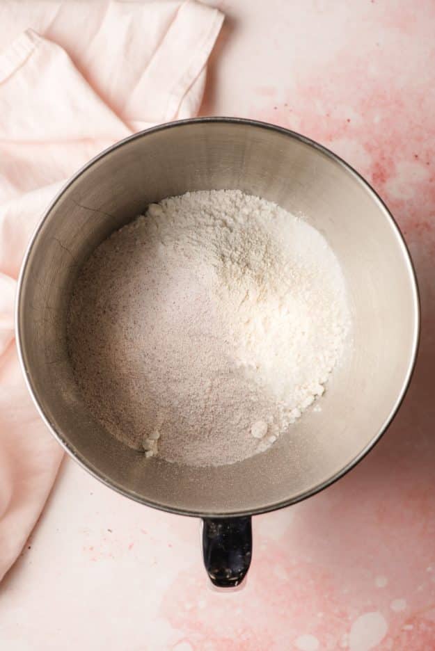 Cake mix, flour, and sugar in a bowl.