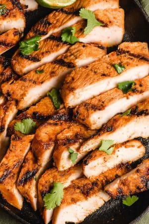Spicy grilled turkey breast strips on a skillet.